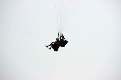 Low angle view of man against clear sky