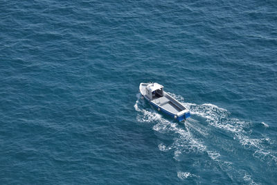 High angle view of boat in calm blue sea