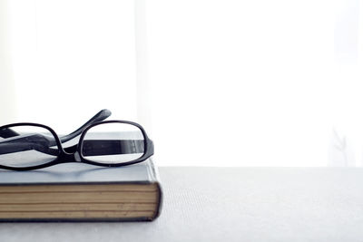 Close-up of sunglasses on table