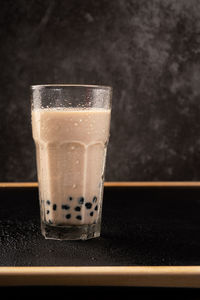 Close-up of coffee in glass on table