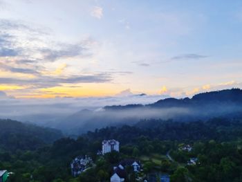 Scenic view of mountains against sky at sunset