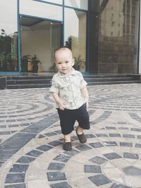 Full length of cute baby boy standing on floor