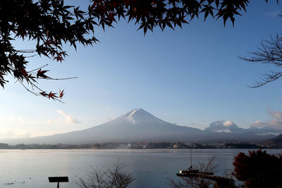 Scenic view of mountains against blue sky