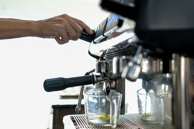 Barista is making drinks in the coffee shop. in thailand selective focus blur background concept