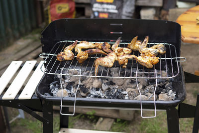 High angle view of meat on barbecue grill