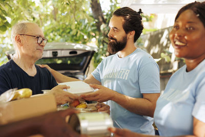 Portrait of senior man preparing food in restaurant