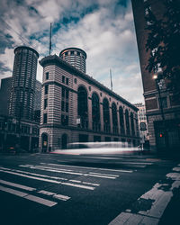 View of buildings against cloudy sky