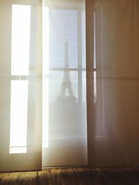 Eiffel tower seen through window