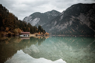 Scenic view of lake and mountains against sky