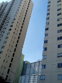 Low angle view of modern buildings against clear sky