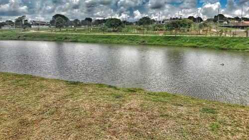 Scenic view of farm against sky