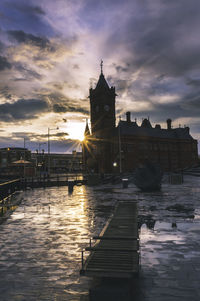 View of river in city at sunset