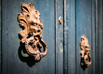 Close-up of rusty door knocker