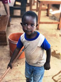 Portrait of boy standing outdoors