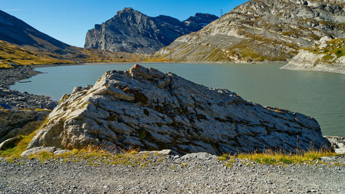 Scenic view of lake and mountains against sky