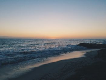 Scenic view of sea at sunset