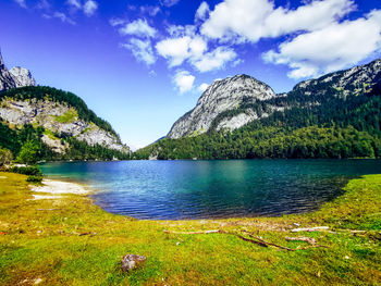 Scenic view of lake and mountains against sky