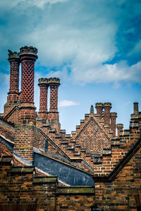 Buildings in city against sky