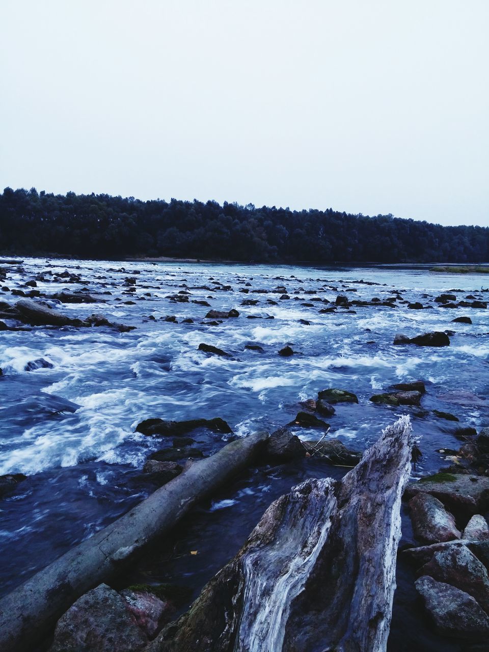 water, tranquil scene, scenics, clear sky, winter, cold temperature, tranquility, snow, beauty in nature, nature, copy space, frozen, sea, rock - object, sky, outdoors, idyllic, no people, river, non-urban scene