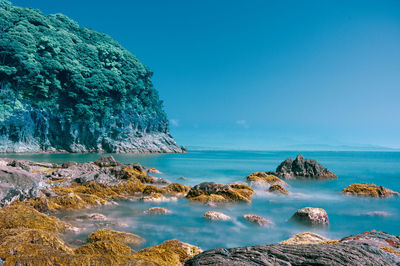 Panoramic view of sea against blue sky