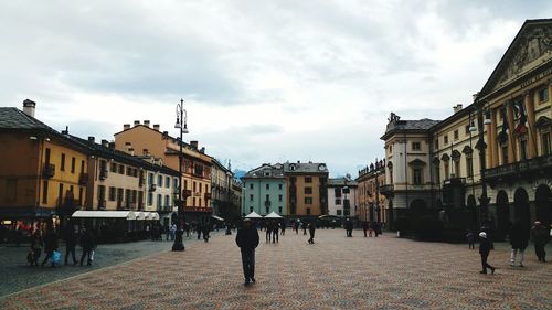 People walking on street in city