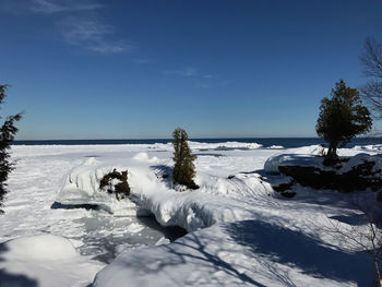  snow and ice covered landscape against sky