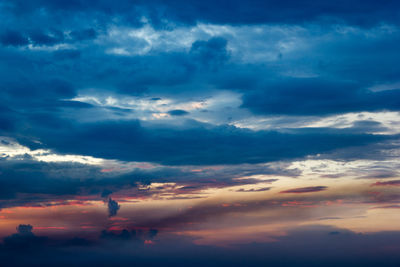 Low angle view of silhouette bird flying against sky during sunset