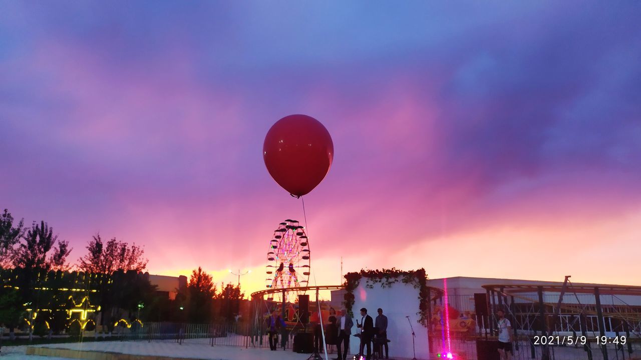 sky, balloon, sunset, nature, architecture, transportation, hot air balloon, evening, city, dusk, cloud, multi colored, vehicle, group of people, travel, celebration, outdoors, twilight, travel destinations, built structure, building exterior, aircraft, night, illuminated, silhouette, event, tree