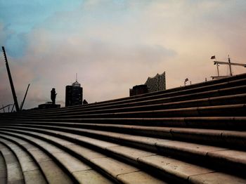 Low angle view of buildings against sky during sunset