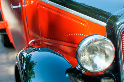 Close-up of vintage car in city