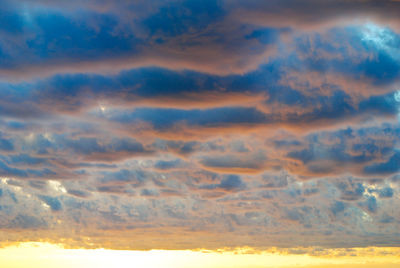 Low angle view of dramatic sky during sunset
