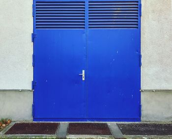 Closed blue door of building