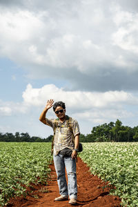 Full length of man standing on field