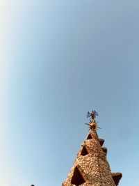 Low angle view of insect against blue sky