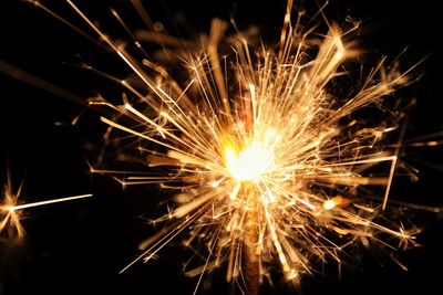 Close-up of sparkler at night