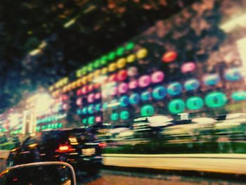 Blurred motion of train on road at night