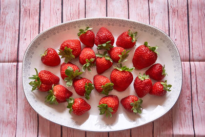 High angle view of strawberries in bowl on table