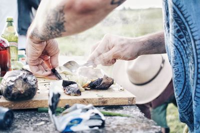 Midsection of man preparing food