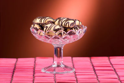 Close-up of pink umbrella on table