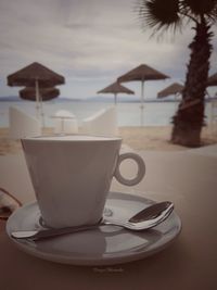 Close-up of coffee cup on table