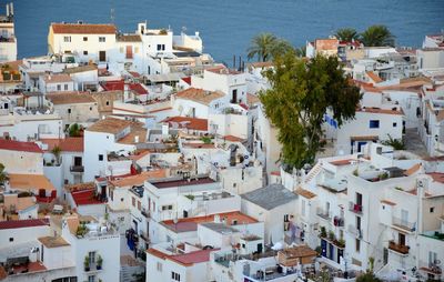 High angle view of townscape by sea