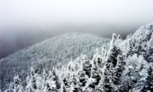 Scenic view of mountain against cloudy sky
