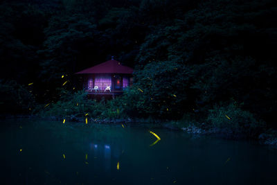 Building by lake at night