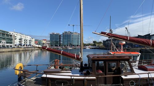 Small fishing boat safely docked in calm harbour 