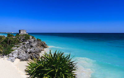 Scenic view of sea against clear blue sky