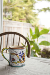 Close-up of coffee cup on table