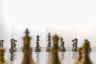 Close-up of chess pieces against the background