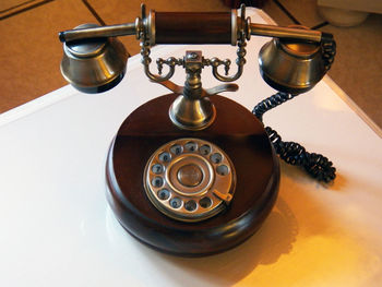 High angle view of telephone on table