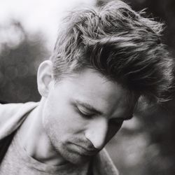 Close-up of young man with spiky hair