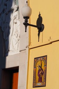 Low angle view of statue against building